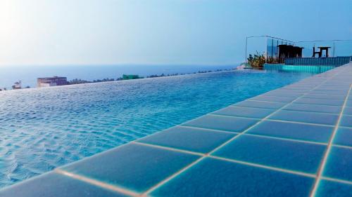 a swimming pool on top of a building at Anarva Hotel & Spa in Mount Lavinia