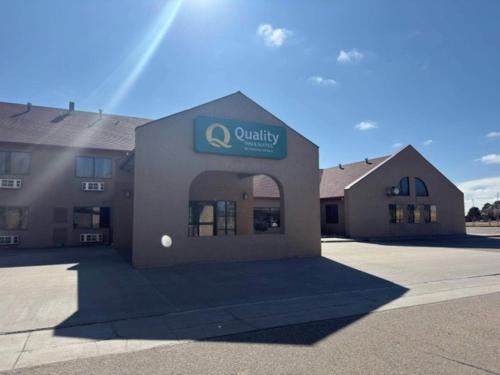 a building with a sign on the front of it at Quality Inn & Suites Colby in Colby