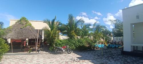a bike parked in front of a building at Maisara lodge in Kilindoni