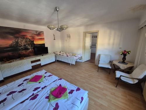 a bedroom with a bed and a living room at Privat Anna in Loket
