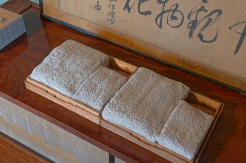 a set of three mats sitting on a table at ISEZI Historic Machiya in Shibata