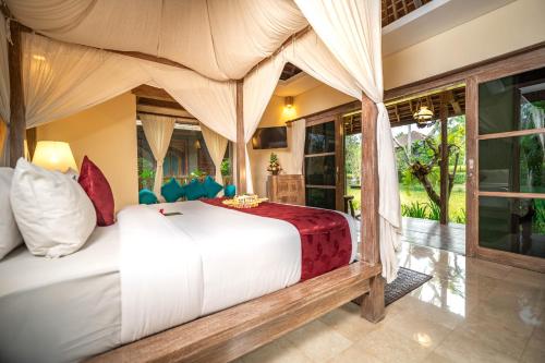 a bedroom with a bed in a room at Ananda Ubud Resort in Ubud