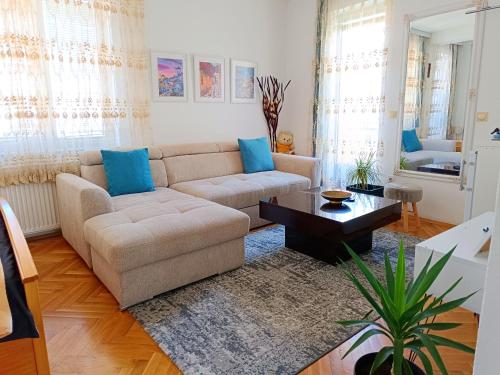 a living room with a couch and a table at Vila Sentić in Vranje
