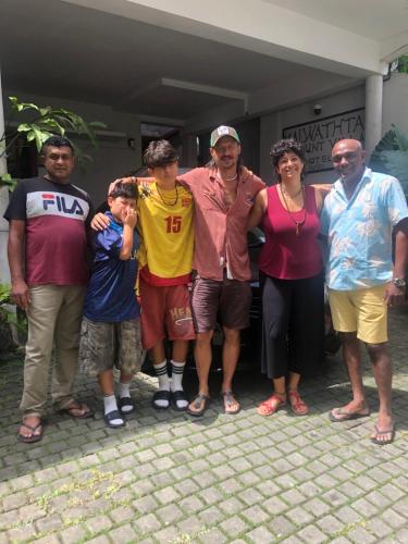 a group of people standing in front of a house at MALWATHTHA MOUNT VILLA KANDY in Kandy