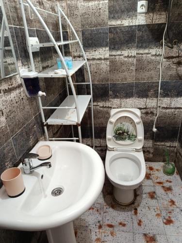 a bathroom with a sink and a toilet at Apartment Ureki in Ureki
