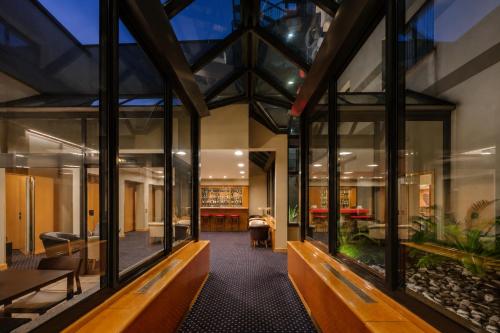 an internal view of a building with large windows at City Life Hotel Poliziano, by R Collection Hotels in Milan