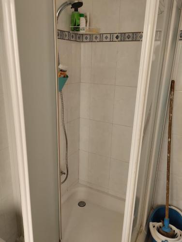 a bathroom with a shower with a toilet at Comfortable 2-Bedroom Apartment, Monte Sossego in Mindelo
