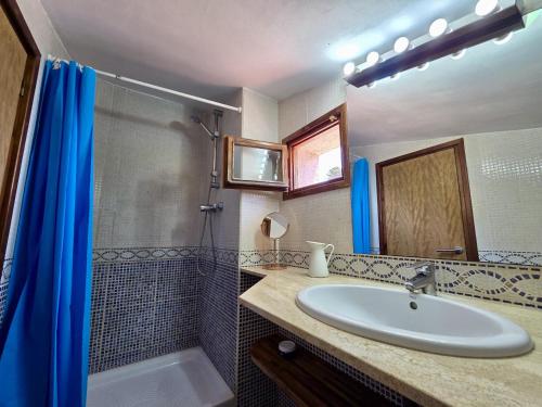 a bathroom with a sink and a shower at EVH137 Can Biel in Tossa de Mar