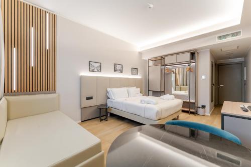 a living room with a bed and a sink at Acca Sporting Milano - AA Hotels in Opera