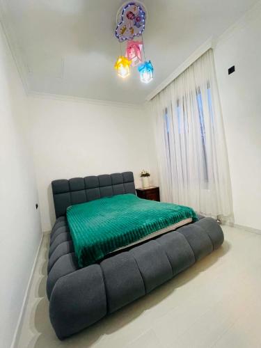a bedroom with a large bed in a room at Appartaments Anna Kostava in Kobuleti