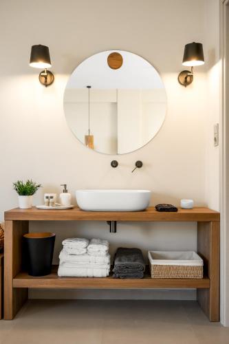 a bathroom with a sink and a mirror at Gaia-Castle vista in Monemvasia