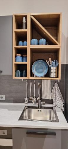 a kitchen with a sink and a counter top at Luana in Caltagirone