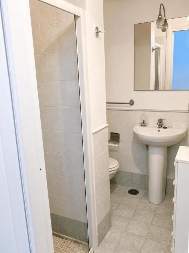 a bathroom with a toilet and a sink at Pietra & Mare Ostuni in Villanova di Ostuni