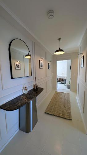 a large hallway with a counter and a mirror at FREISTIEL 4 in Hattenheim