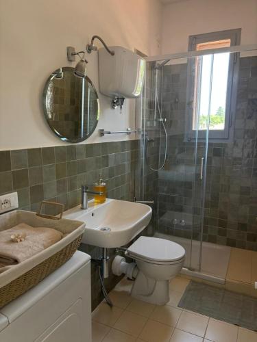 a bathroom with a toilet and a sink and a shower at Le Finestre in Città della Pieve