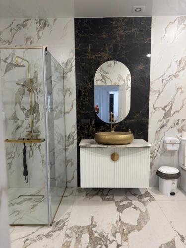 a bathroom with a sink and a mirror at Events house With Swimming Pool in Agarak