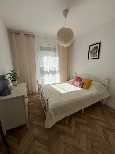 a hospital bed in a room with a window at Dolce Vita in Gdynia