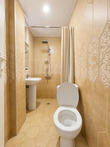 a bathroom with a toilet and a sink at Sky Star in Kazbegi