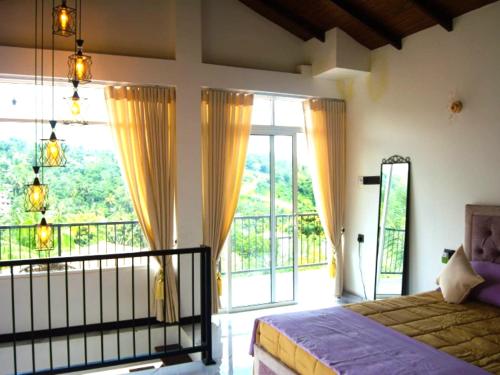 a bedroom with a bed and a large window at The Mulberry Villa kandy in Kandy