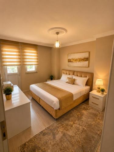 a bedroom with a large bed in a room at Trabzon Zingila Residence in Yomra