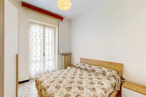 a bedroom with a bed and a window at [DolciAcque] Dolce sosta nel cuore di Acqui in Acqui Terme