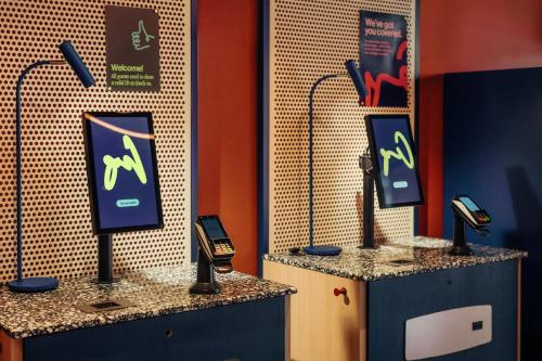 a room with two hair stations with phones on them at Scandic Go, Eerikinkatu 30 in Turku