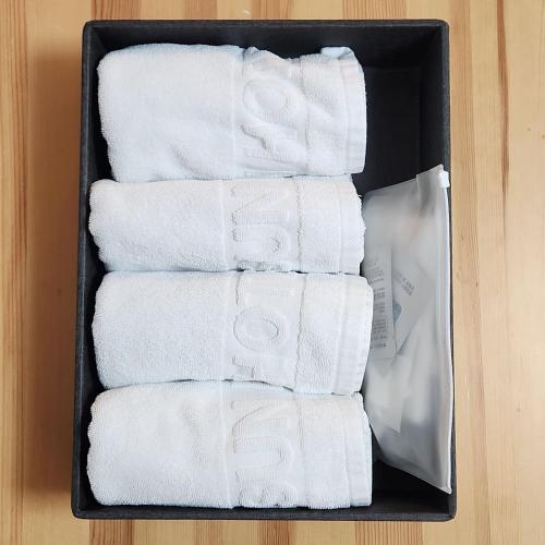 a black box filled with white towels at 통영호텔조선 in T'ongyŏng