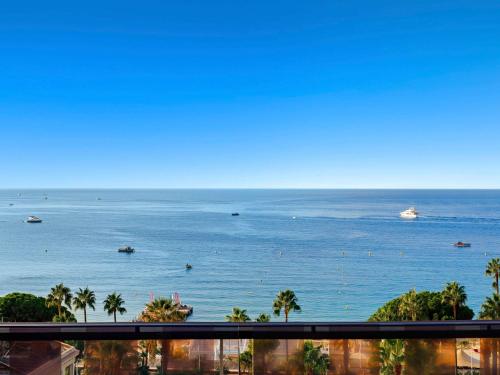 a view of the ocean from a balcony at Mondrian Cannes in Cannes