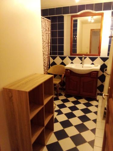 a bathroom with a sink and a mirror at Chambres d'hôtes 05 Crévoux in Crévoux