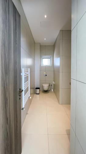 a bathroom with a toilet and a sink at Love Bridge Seaview Villas in Ayia Napa