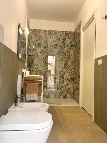 a bathroom with a toilet and a shower at 'Na Scalunera in Mezzojuso