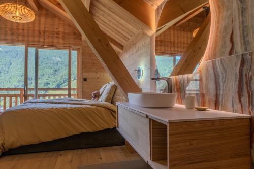 a bathroom with a bed and a sink in a room at Jag Peak in Champcella