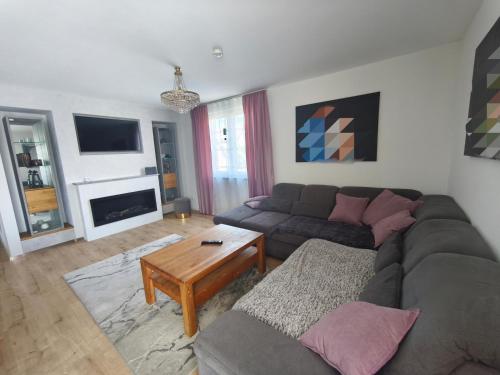 a living room with a couch and a table at Zeitlos in Stutensee