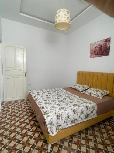 a bedroom with a bed in a room at blue house in Carthage