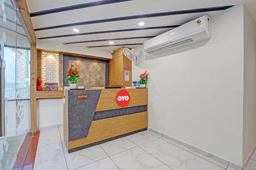 a stop sign on a counter in a room at Hotel O Max Inn in Ahmedabad