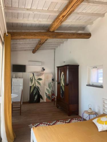 a bedroom with a bed and a wooden ceiling at Il Respiro degli Ulivi in Viterbo