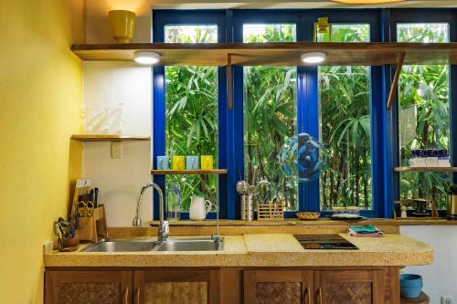 a kitchen with a sink and a window at Loft House 2BR Beachside An Bang Beach Hoi An by Beachside Boutique Homes in An Bàn (2)