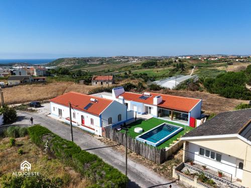 an aerial view of a house with a swimming pool at OceanLand - Santa Cruz in Santa Cruz