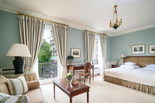 a hotel room with a bed and a desk at Brenners Park Hotel & Spa, Oetker Hotels in Baden-Baden