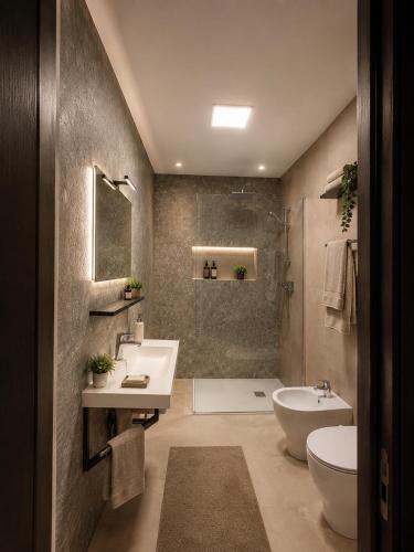 a bathroom with a sink and a tub and a toilet at Villa GAUDÌ in Sant'Isidoro