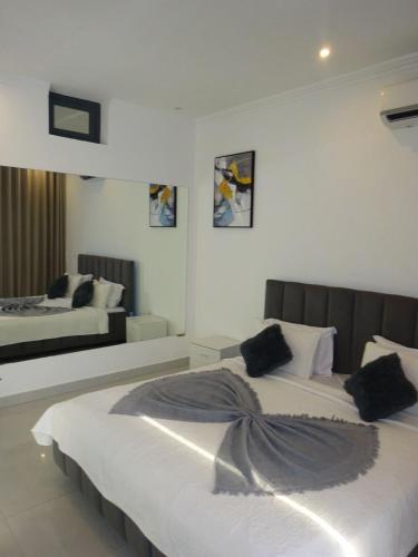 a bedroom with two beds in a room at Room View boutique in Luanda