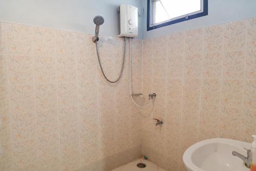 a bathroom with a shower and a sink at House Number 3 in Phitsanulok