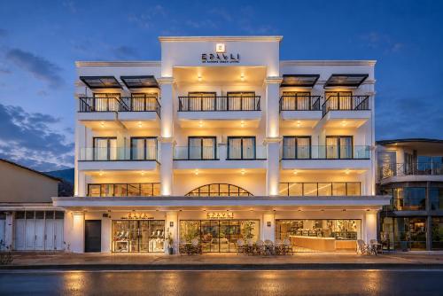a large white building with a sign on it at Enorme Epavli Urban Living in Hersonissos