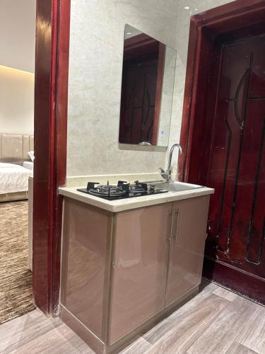 a bathroom with a sink and a mirror at الملاذ الهادي in Al-ʿUla