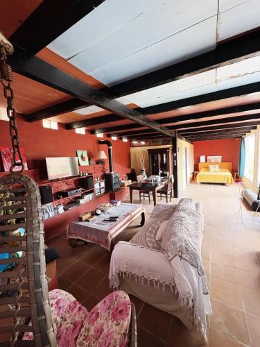 a room with a bed and a table in it at Centro Ave Fénix in Femés