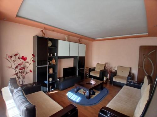 a living room with a couch and a table at Teo&Alex in Năvodari