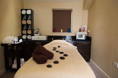 a hotel room with a bed with a mirror at The Parsonage Hotel & Spa in York
