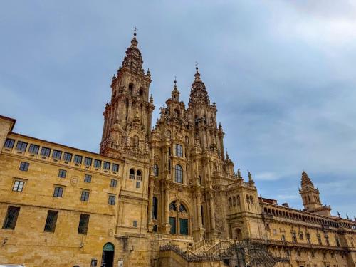 a large building with a tower on top of it at Hotel Faranda Los Tilos, Ascend Hotel Collection in Santiago de Compostela