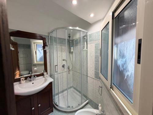 a bathroom with a shower and a sink at Casa del Borgo, between Mountains and Lake, Near Rome in Canepina