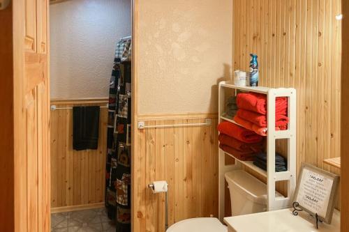 a bathroom with a toilet and a towel rack at Mountain Escape in Sturgis